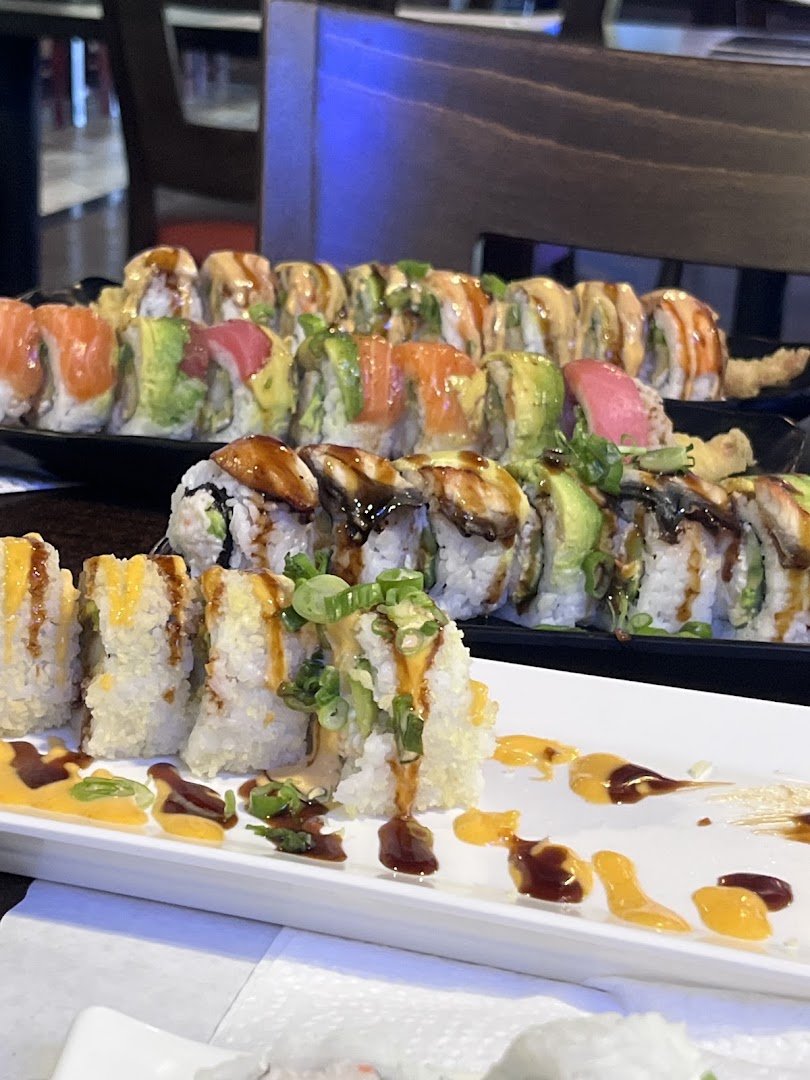 Colorful rolls beside soy sauce and ginger